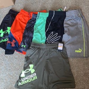 Seven youth small shorts (6 under armour, 1 puma)